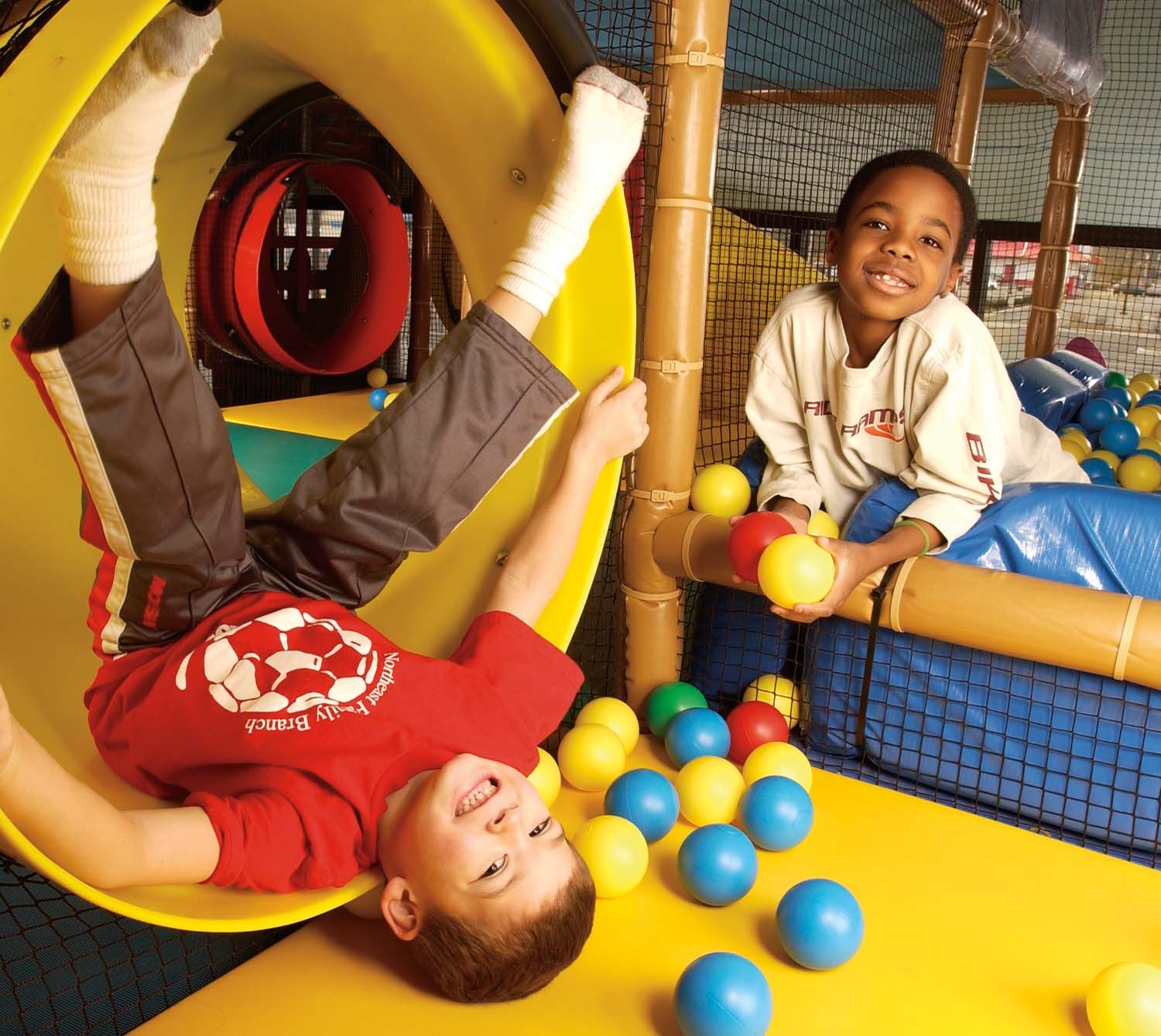 Two Young Boys Playing in the Tubes